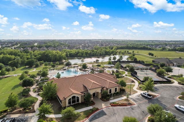 birds eye view of property featuring a water view and a residential view