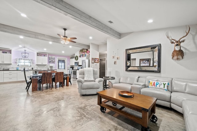 living room featuring beamed ceiling, a ceiling fan, recessed lighting, and visible vents
