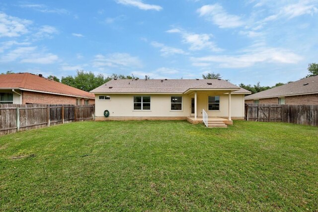 1400 Chardonnay Xing, Leander, TX 78641 - back of property featuring a fenced backyard and stucco siding