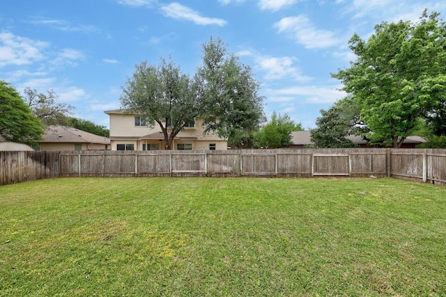 view of yard featuring a fenced backyard