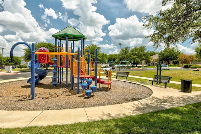 community playground featuring a yard