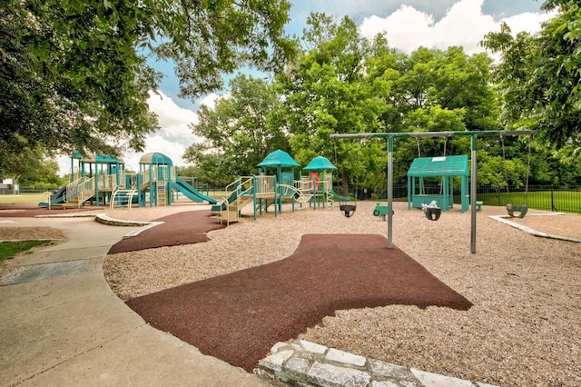 communal playground featuring fence