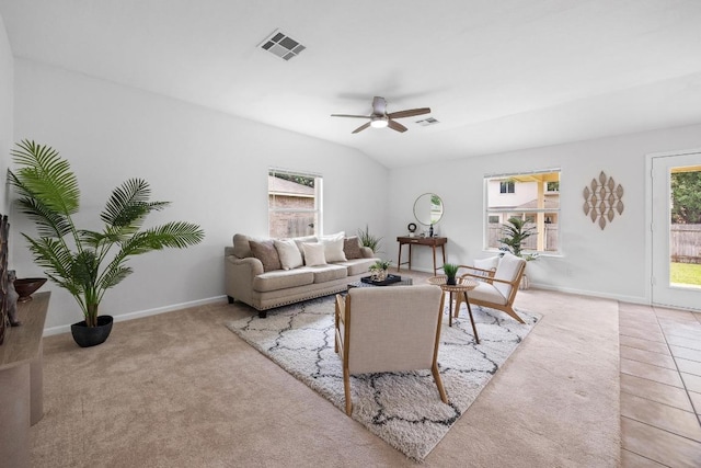 carpeted living room featuring baseboards, ceiling fan, and visible vents