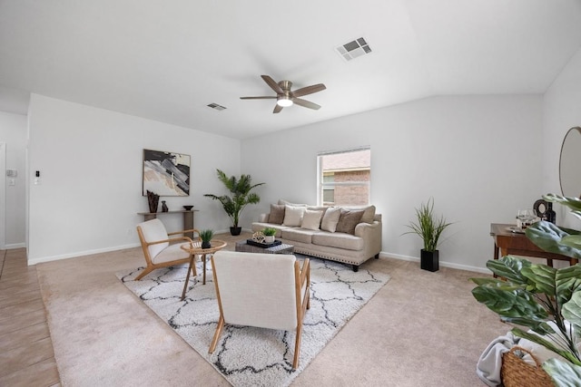 living room with carpet floors, a ceiling fan, and visible vents