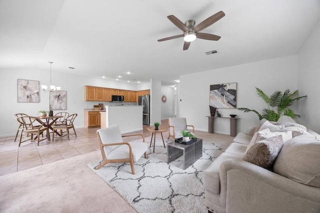 living area with baseboards, ceiling fan with notable chandelier, light colored carpet, and visible vents