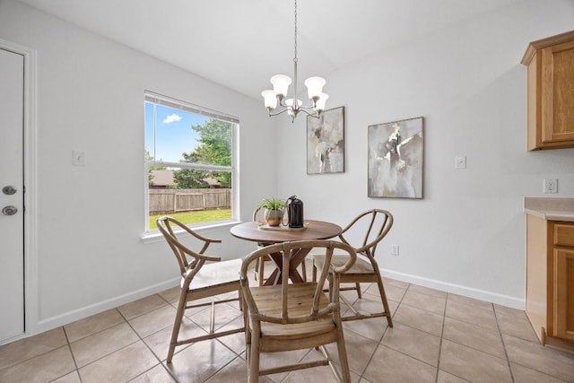 1400 Chardonnay Xing, Leander, TX 78641 - dining space with light tile patterned floors and a chandelier