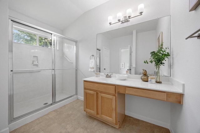 full bathroom featuring baseboards, a shower stall, tile patterned flooring, and vanity