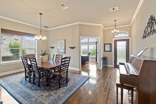 13358 Mesa Verde Dr, Austin, TX 78737 - dining area with a chandelier, dark wood-type flooring, and ornamental molding