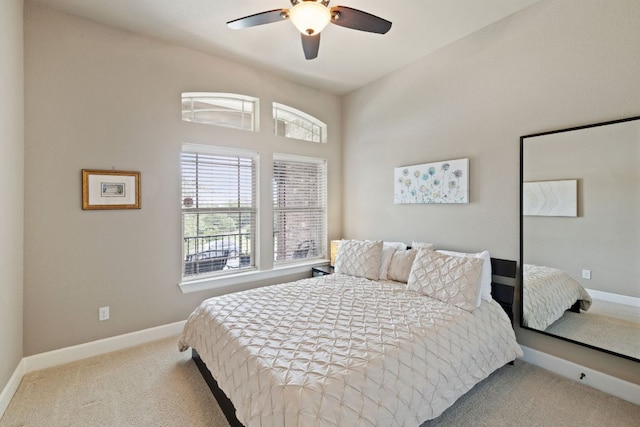 carpeted bedroom with baseboards and ceiling fan