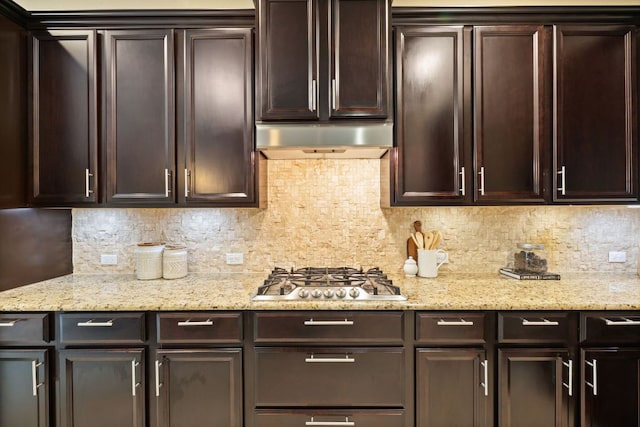 13358 Mesa Verde Dr, Austin, TX 78737 - kitchen with stainless steel gas stovetop, dark brown cabinetry, ventilation hood, and decorative backsplash