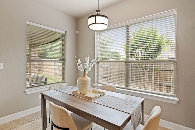 dining room with baseboards and tile patterned floors