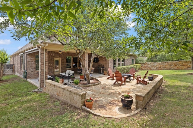 13358 Mesa Verde Dr, Austin, TX 78737 - back of house featuring a patio area, brick siding, and an outdoor fire pit