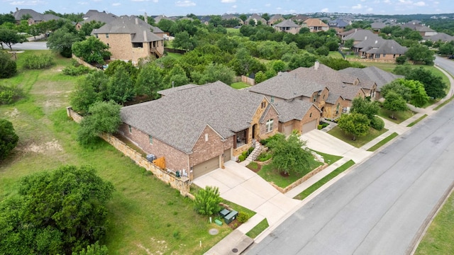 birds eye view of property with a residential view