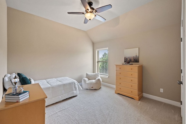 carpeted bedroom featuring baseboards, a ceiling fan, and vaulted ceiling