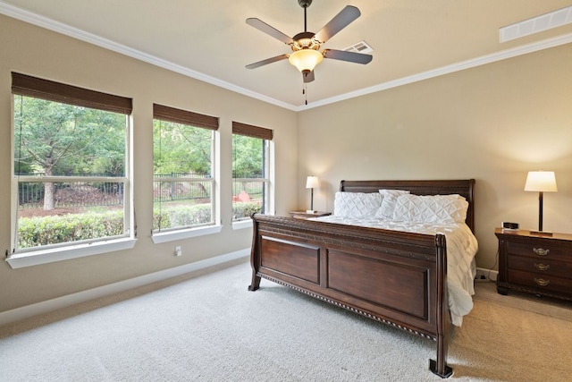 bedroom with baseboards, ornamental molding, light carpet, and visible vents