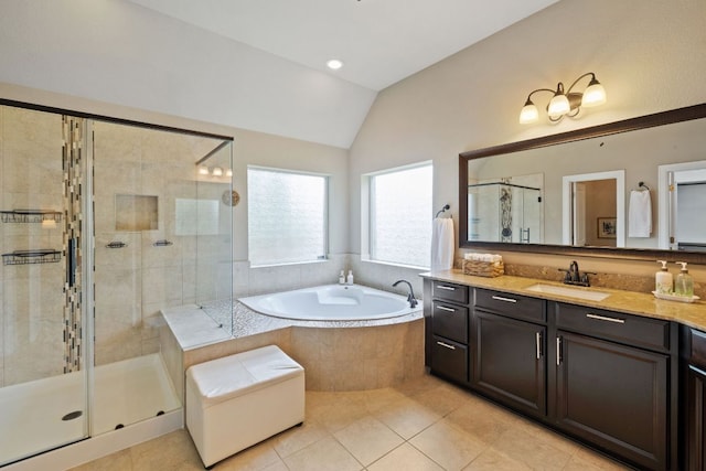 13358 Mesa Verde Dr, Austin, TX 78737 - bathroom with lofted ceiling, a garden tub, vanity, a shower stall, and tile patterned flooring