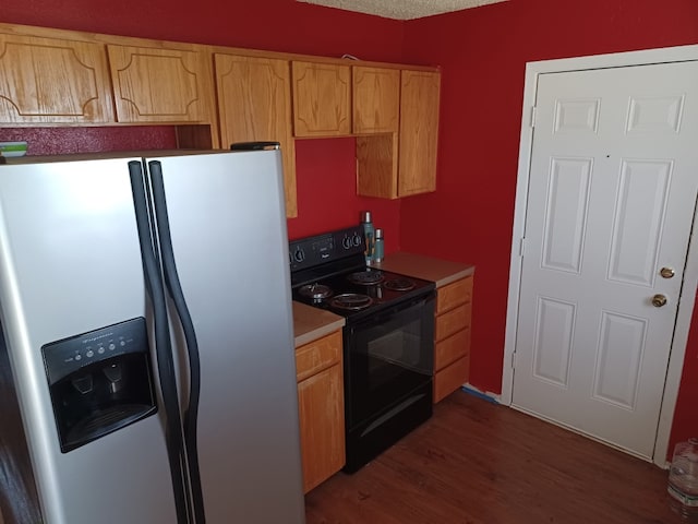 913 N 19th St, Copperas Cove, TX 76522 - kitchen featuring stainless steel refrigerator with ice dispenser, black / electric stove, dark wood finished floors, light countertops, and light brown cabinetry