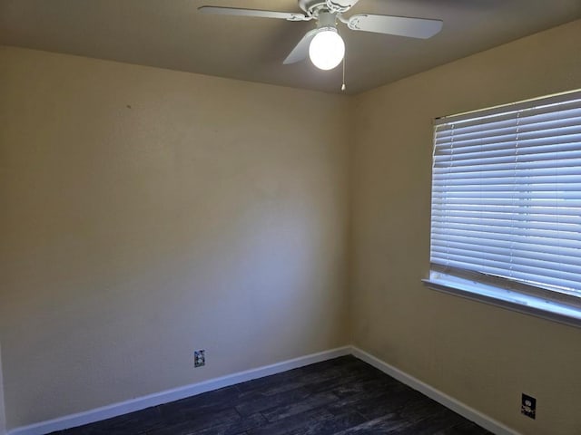 684 Atlantis, Kyle, TX 78640 - unfurnished room with a ceiling fan, baseboards, and dark wood-type flooring