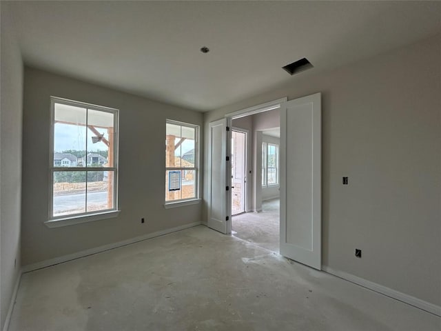 empty room with baseboards