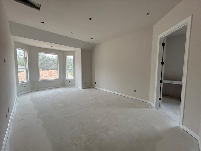 empty room featuring baseboards