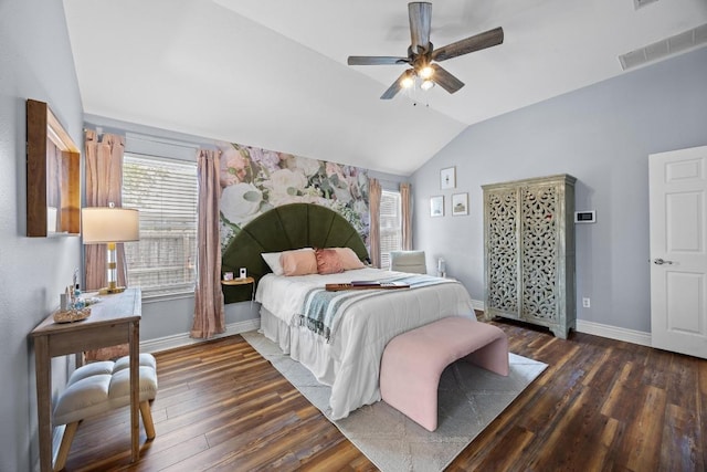 bedroom featuring baseboards, wood finished floors, vaulted ceiling, and visible vents
