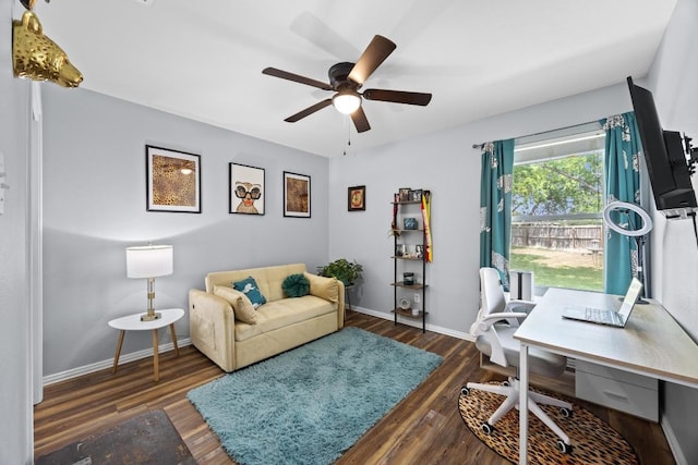 office space with baseboards, ceiling fan, and wood finished floors