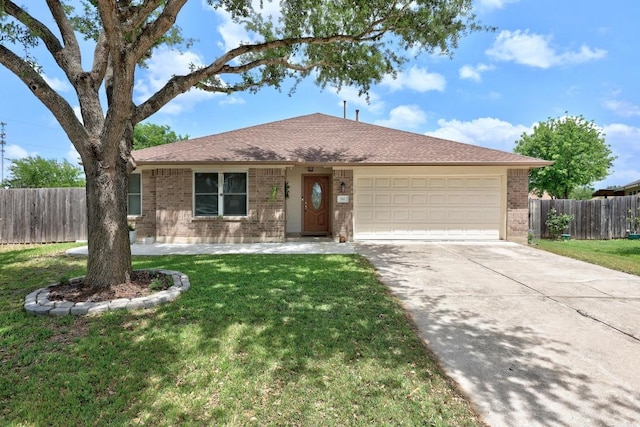 ranch-style home with driveway, a front yard, a garage, brick siding, and fence
