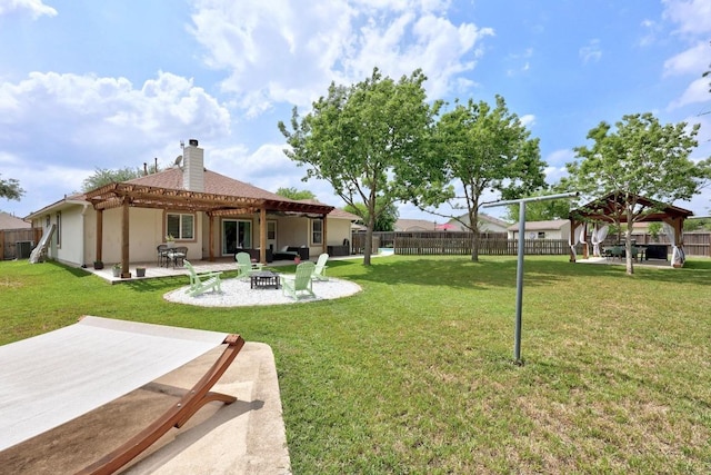 view of yard with a pergola, a fenced backyard, a patio area, and an outdoor fire pit