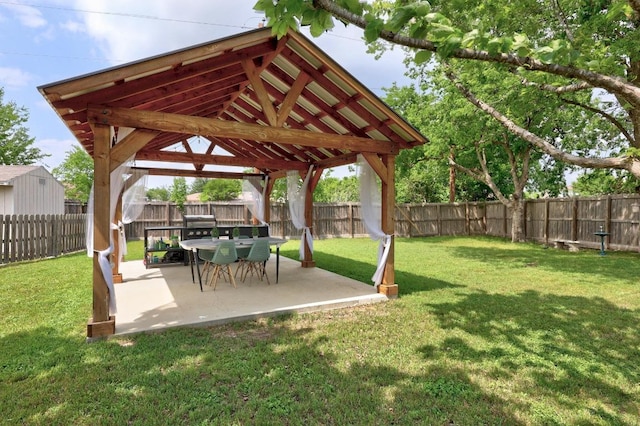 view of yard featuring a gazebo, a fenced backyard, and a patio
