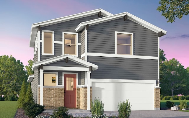 traditional-style home with an attached garage, driveway, and brick siding