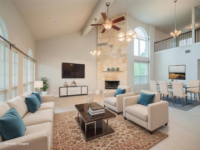 800 Savannah Cv, Elgin, TX 78621 - living area featuring a chandelier, high vaulted ceiling, ceiling fan, a fireplace, and beamed ceiling