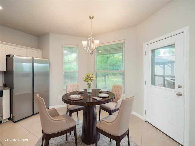 800 Savannah Cv, Elgin, TX 78621 - dining space with light tile patterned floors, healthy amount of natural light, and a chandelier