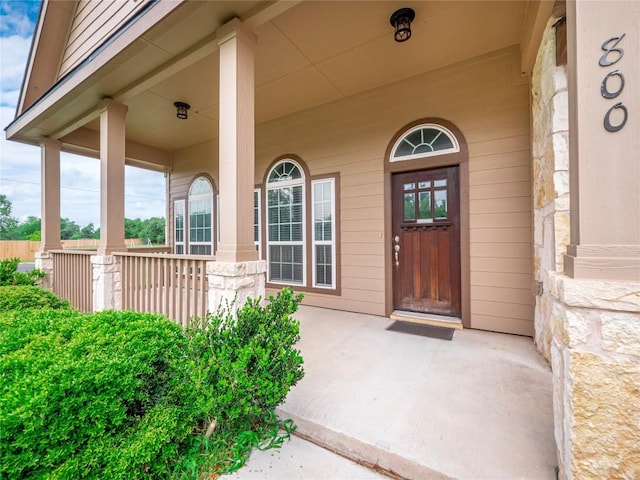 800 Savannah Cv, Elgin, TX 78621 - view of exterior entry featuring a porch and stone siding