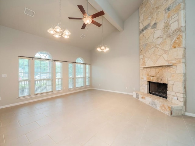 unfurnished living room featuring visible vents, beam ceiling, a stone fireplace, high vaulted ceiling, and ceiling fan with notable chandelier