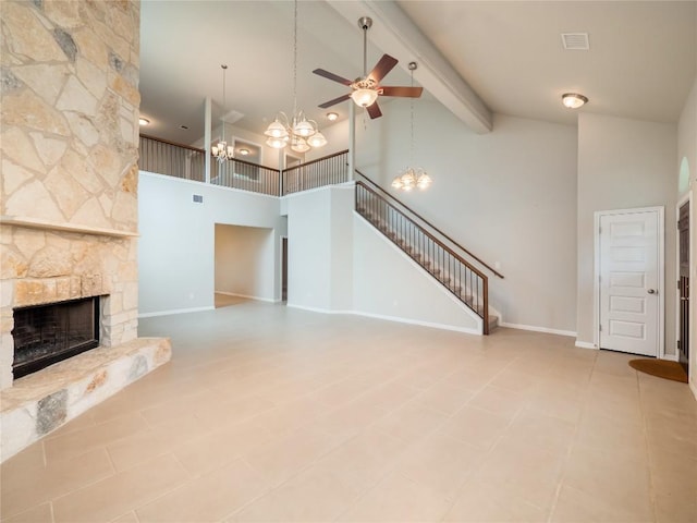 unfurnished living room featuring a fireplace, high vaulted ceiling, ceiling fan with notable chandelier, beamed ceiling, and stairway