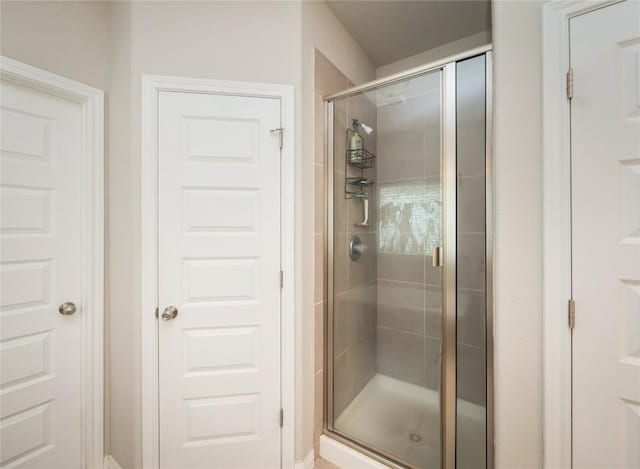 bathroom with a shower stall