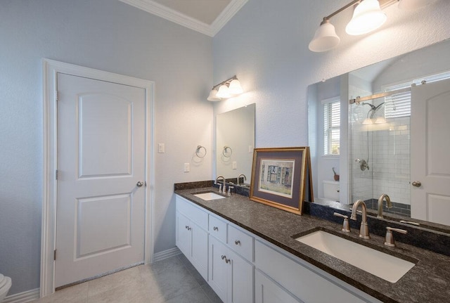 bathroom with a shower stall, toilet, ornamental molding, and a sink