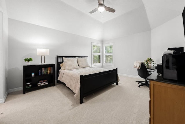 bedroom featuring vaulted ceiling, baseboards, light carpet, and a ceiling fan