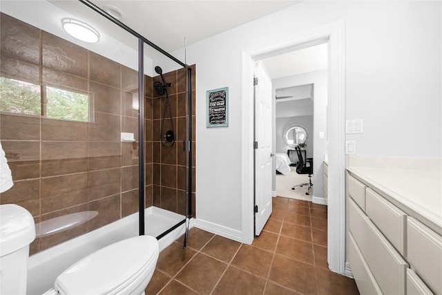 full bath featuring toilet, tile patterned floors, a shower stall, and ensuite bathroom