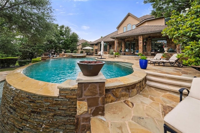 outdoor pool featuring a patio area