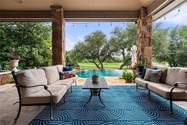 view of patio with an outdoor pool and an outdoor hangout area