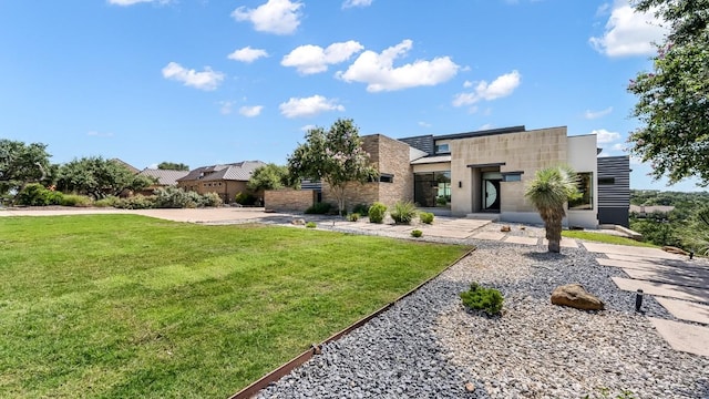 contemporary house featuring a front lawn