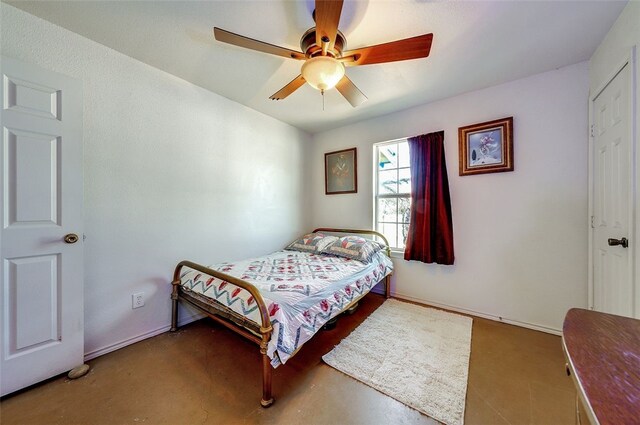 6637 River Oaks Dr, Kingsland, TX 78639 - bedroom featuring ceiling fan and concrete flooring