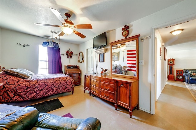 bedroom with ceiling fan and visible vents
