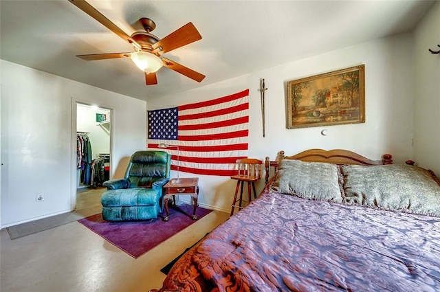 bedroom featuring baseboards, ceiling fan, a spacious closet, and a closet