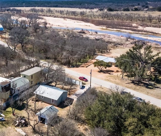 birds eye view of property with a rural view