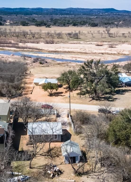 birds eye view of property featuring a rural view