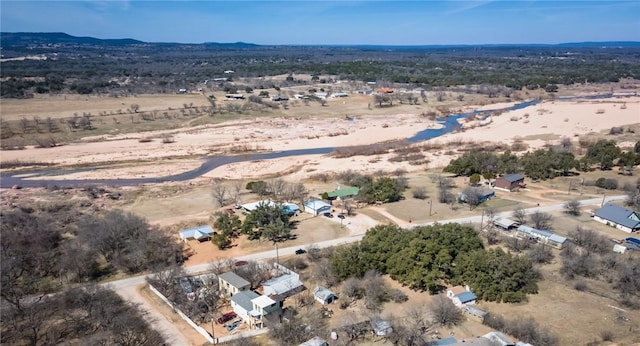 bird's eye view featuring a rural view, a mountain view, and a desert view