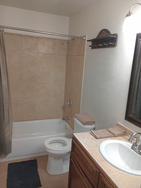 6637 River Oaks Dr, Kingsland, TX 78639 - bathroom with toilet, shower / bathtub combination, vanity, and tile patterned flooring