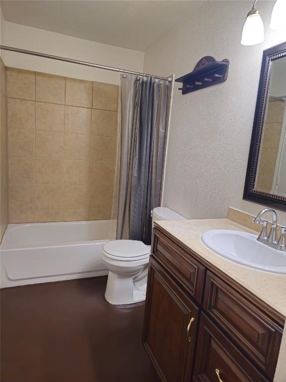 6637 River Oaks Dr, Kingsland, TX 78639 - full bathroom with vanity, toilet, shower / bath combination with curtain, and a textured wall